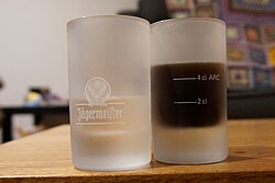 Shot glasses with centilitre fill line graduations. "ARC" is the maker's (Arc International) certification of accuracy.