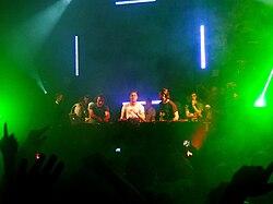 Swedish House Mafia and Italian DJ Benny Benassi performing in 2011.