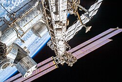 High elevation view of the truss steelwork, port-side radiators and solar arrays, in 2019