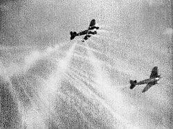 Gun camera film showing tracer ammunition from a Supermarine Spitfire hitting a Heinkel He 111 bomber on its starboard quarter
