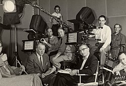 Ray Culley of Cinécraft Productions used two or more cameras with teleprompters and rear screen projectors extensively in filming early television programs.