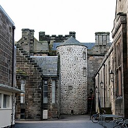 The round tower (apparently known as the Ivy Tower) from ca. 1525 is one of the oldest parts of King's College (the University of Aberdeen) but it is now almost surrounded by later buildings.