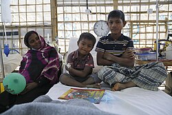 Rohingya children with their mother after being treated for diphtheria by the UK's emergency medical team in Kutupalong refugee camp.