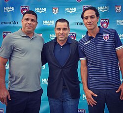 Miami FC President and co-owner, Riccardo Silva (center) with Ronaldo Luís Nazário de Lima (left) and former head coach, Alessandro Nesta (right)