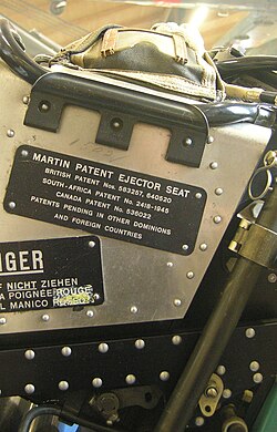 The plate of the Martin ejector seat of a military aircraft, stating that the product is covered by multiple patents in the UK, South Africa, Canada and pending in "other" jurisdictions. Dübendorf Museum of Military Aviation.