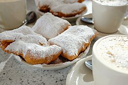 Café au lait and beignets at Café Du Monde in New Orleans
