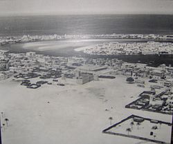 Dubai in 1950: the area in this photo shows Bur Dubai in the foreground (centred on Al-Fahidi Fort), Deira in middle-right on the other side of the creek, and Al Shindagha (left) and Al Ras (right) in the background across the creek, from Deira.