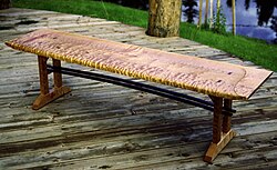 A bench made of highly figured maple wood