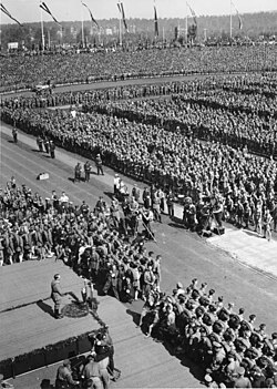 Hitler was the focal point at the 1934 Nuremberg Rally. Leni Riefenstahl and her crew are visible in front of the podium.