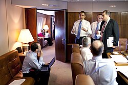 President Barack Obama meets staff mid-flight aboard Air Force One, in the conference room on 3 April 2009.