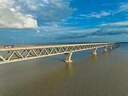 A long, straight, flat bridge over a large body of water