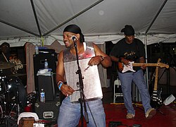A zydeco musician playing a vest frottoir