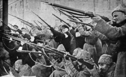 Revolutionaries attacking the tsarist police in the early days of the February Revolution