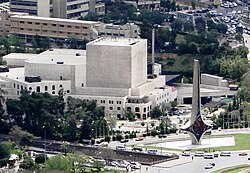 The Damascus Opera House (opened in 2004) stands behind the Damascene Sword Monument, a landmark erected in 1960 in the Umayyad Square