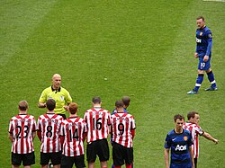 Rooney lines up a free kick against Sunderland on the final day of the 2011–12 Premier League season. Despite Rooney's winner, United lost out on the league title to Sergio Agüero's last minute goal for Manchester City.