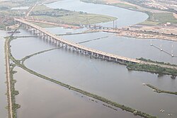 Aerial view of the Lewandowski Bridge over the Passaic River in 2023, flanked by the DB Draw (left), the under-construction Portal North Bridge, and the Portal Bridge (right)