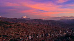 La Paz is characterized by its mountainous geography. The snow-capped Illimani dominates the city's skyline