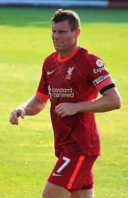 James Milner, vice-captain of Liverpool from 2015 to 2023. As depicted in the image, vice-captains serve as their team's captain when the regular captain is not included in the starting eleven, or if, during a game, the captain is substituted or sent off.