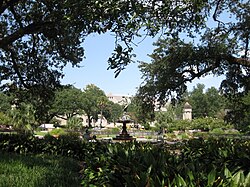 One of the fountains at Audubon Park with Tulane University in the background.
