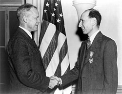 Wigner receiving the Medal for Merit for his work on the Manhattan Project from Robert P. Patterson (left), March 5, 1946