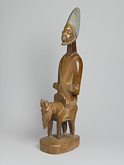 Shango, the Orisha of fire, lightning, and thunder, in the Yoruba religion, depicted on horseback
