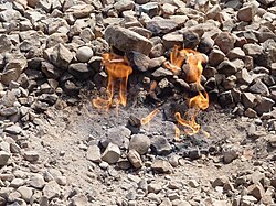 Burning of natural gas coming out of the ground