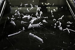 In cloud chambers a liquid (sometimes water, but usually isopropanol) condenses upon contact with a particle of radiation thus producing an effect similar to contrails