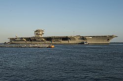 Enterprise under tow to Newport News Shipbuilding to begin the defuelling process in June 2013