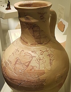 "The dedicatory inscription on the Lachish ewer [shows] the word Elat positioned immediately over the tree, indicating the... tree as a representation of the goddess Elat."[18]