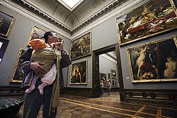 Paintings arranged in groupings in the "salon style"