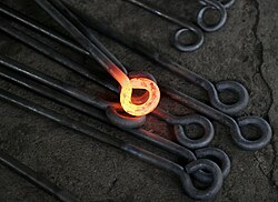 Thermal radiation in visible light can be seen on this hot metalwork. Its emission in the infrared is invisible to the human eye. Infrared cameras are capable of capturing this infrared emission (see Thermography).