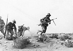 Italian troops charging in the desert.