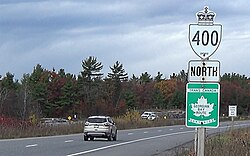 A Canadian provincial highway double-signed with a numberless, but named, national Trans-Canada marker
