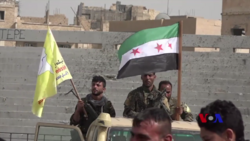 FSA SDF fighters after the capture of Raqqa stadium