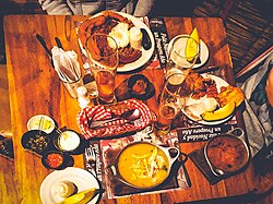 Bandeja paisa (top) and Ajiaco (bottom) are two of the most traditional plates in the country.