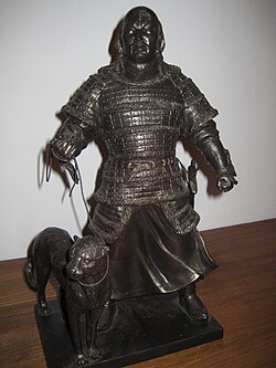 A statue of a Mongol hunter with a tame cheetah