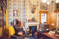Belmont Mansion was occupied by Union troops in December 1864; the library with Union uniforms on some chairs