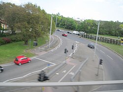 The Cooper Dean Roundabout is a large gyratory. The A3060 Road travels beneath it and the A338 Road crosses it. This picture is taken on the bridge looking east towards Christchurch.