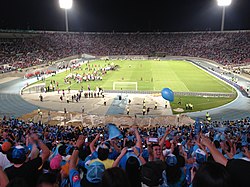 O'Higgins fans celebrating the 2013–14 Apertura title at Estadio Nacional de Chile.