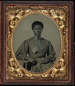 Ambrotype of African-American woman with a flag, "believed to be a washerwoman for Union troops quartered outside Richmond, Virginia" (National Museum of American History 2005.0002)