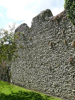 The walled defence round a burgh. Alfred's capital, Winchester. Saxon and medieval work on Roman foundations.[80]