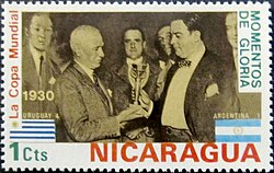 Jules Rimet presents the World Cup trophy to Raúl Jude, president of the Uruguayan Football Association, winners of the inaugural 1930 FIFA World Cup. This trophy was renamed for Rimet in 1946.