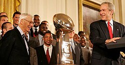 Rooney (left), with President George W. Bush in June 2006 after winning Super Bowl XL