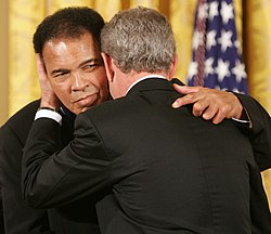 President George W. Bush embraces Ali after presenting him with the Presidential Medal of Freedom in 2005, during ceremonies at the White House.