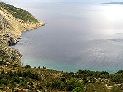 A submarine karst spring, called vrulja, near Omiš; observed through several ripplings of an otherwise calm sea surface.