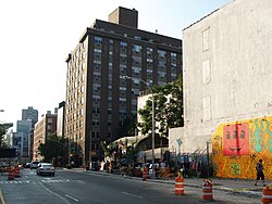 The 2010 recreation of Keith Haring's original 1982 mural; New York City's Bowery Mural wall at Houston Street and the Bowery