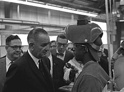 President Johnson speaks with a young welder in San Marcos, Texas, November 1965