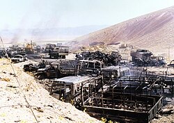 Burned-out vehicles shown in the aftermath of Operation Mersad[citation needed]