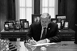 Parson signing a bill in 2019
