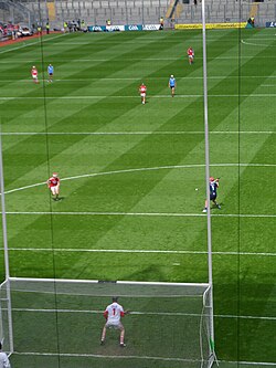 Player taking a penalty puck from the 20-metre line